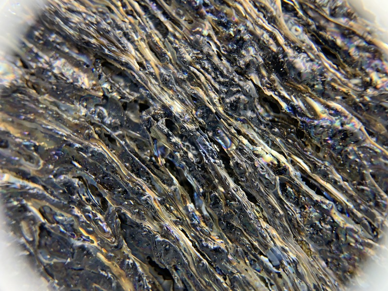 Pele's Hair on vitrified lava, x7 magnification